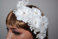 Headdress of flowers, beads and glitter.