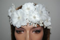 Headdress of flowers, beads and glitter.