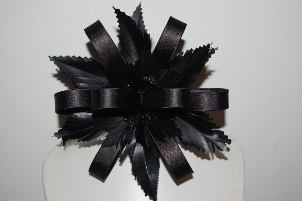 Touched black satin corsage