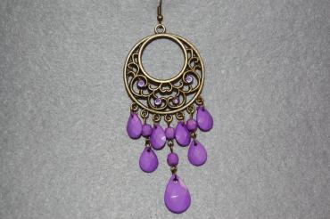 Round purple earrings and sparkles