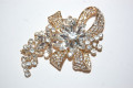 Broche René dorado y brillos