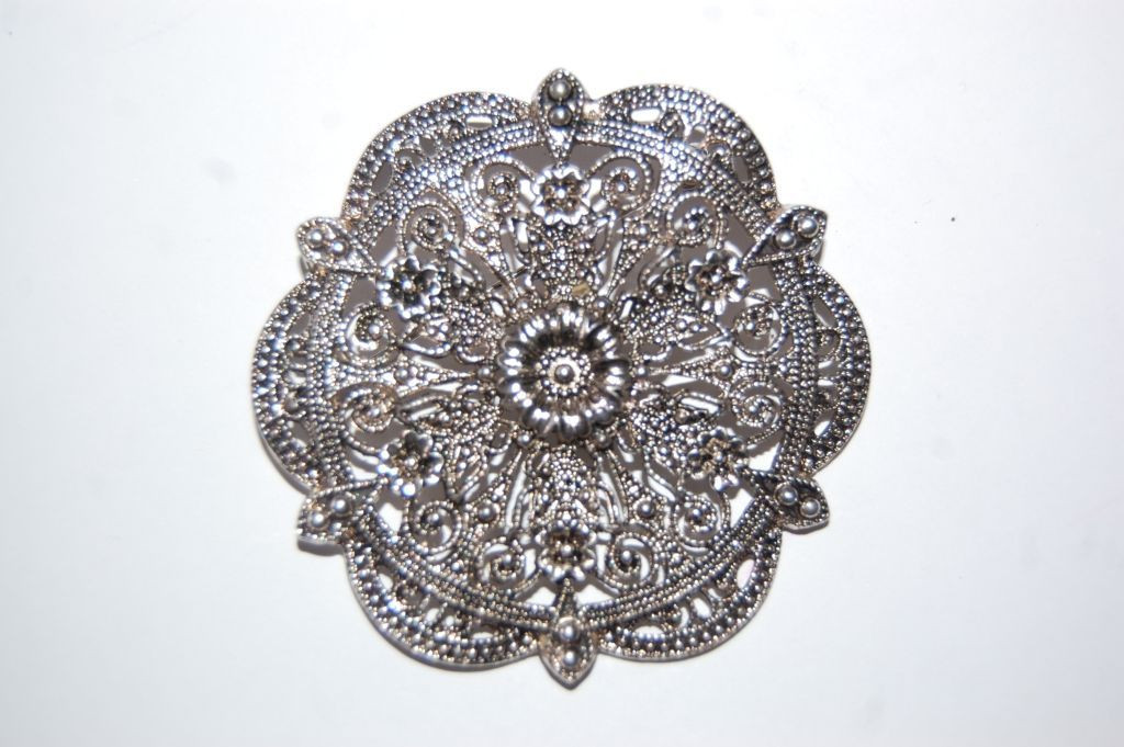 Mercy on old silver brooch