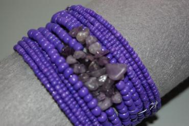Turns purple bracelet and stones.