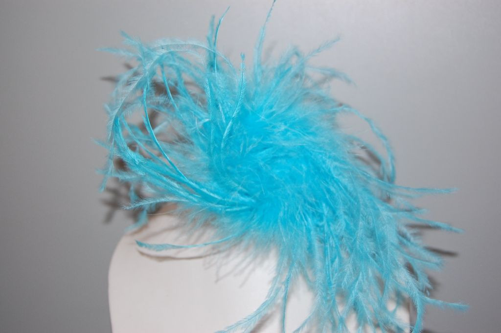 Played uneven turquoise blue feathers