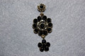 Pending Dione black flowers