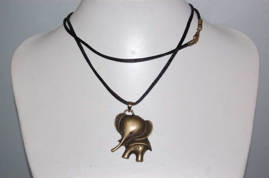 Old gold necklace with elephant