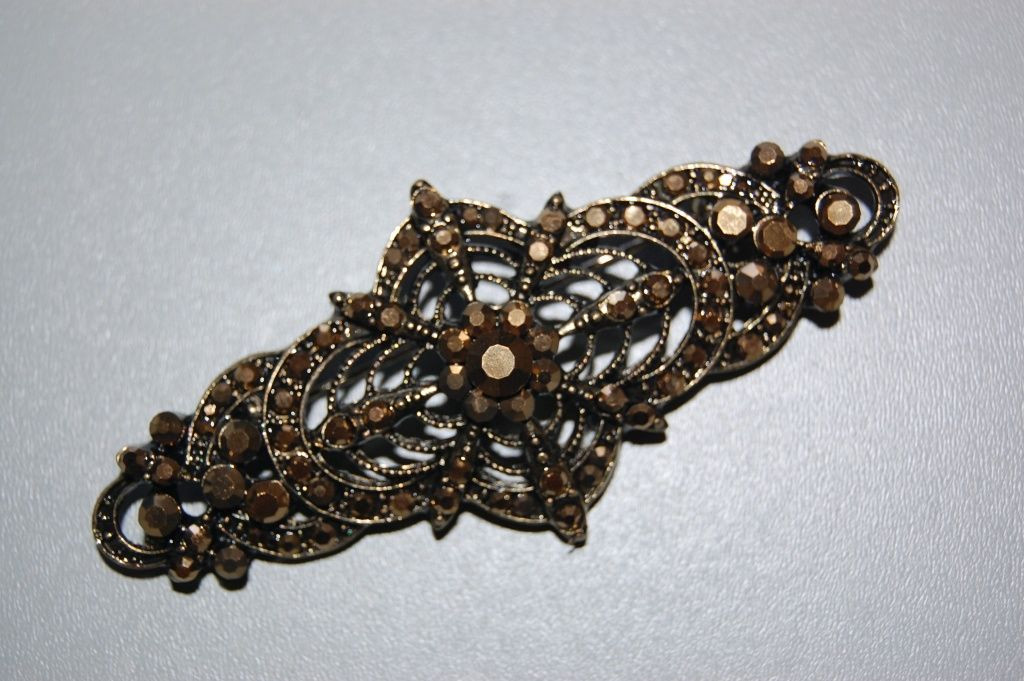 Broche fiesta elegante bronce