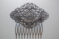 Mermaid comb through old silver