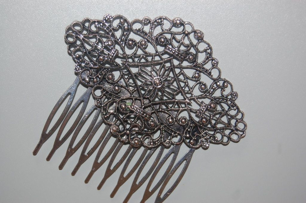 Mermaid comb through old silver